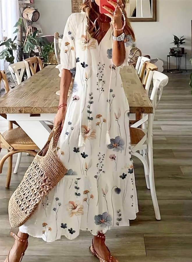 Fashionable midi dress made of cotton blend with floral pattern, pockets, and 3/4 sleeves