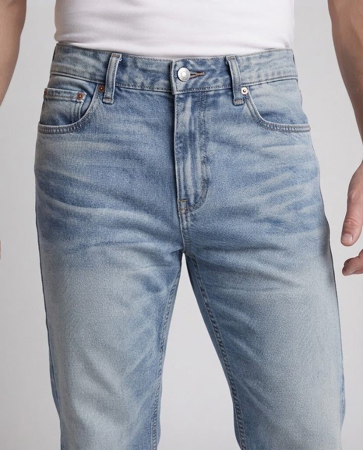 Men's loose-fitting stonewashed denim jeans with floor-length hem and distinctive pleats Mune Fashion
