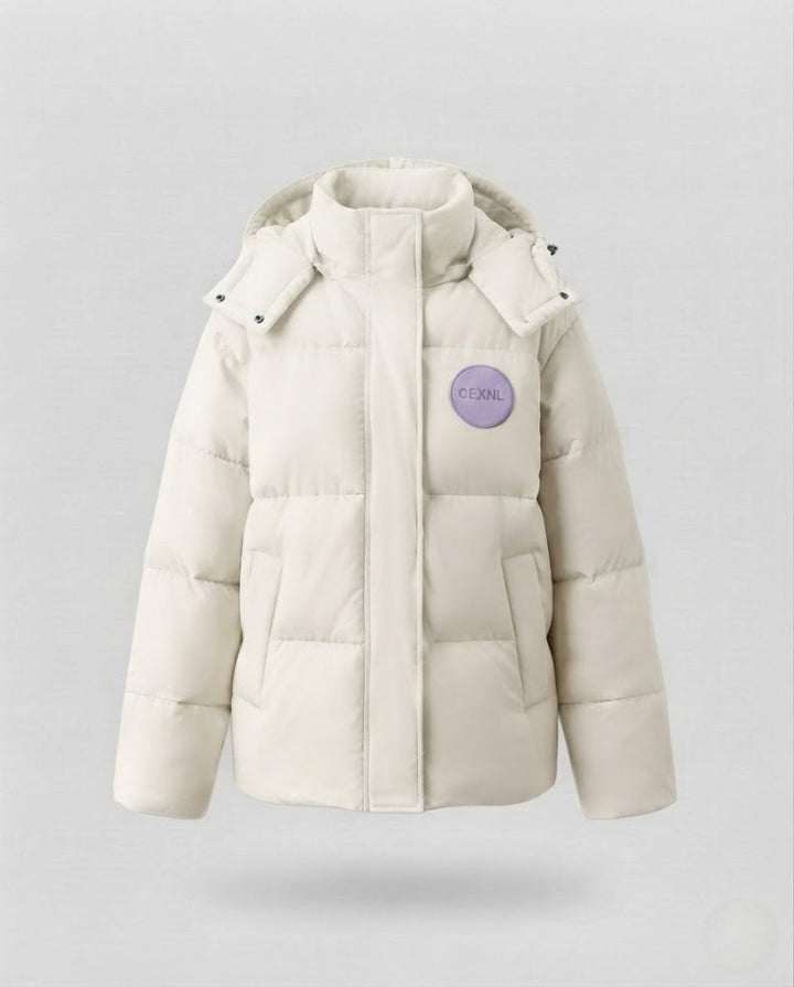 Women's oversized short quilted jacket with high stand-up collar and decorative patch application