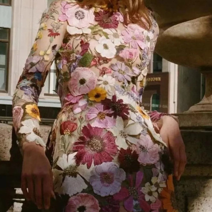 Mune | Mini dress with floral appliqués and transparent appearance