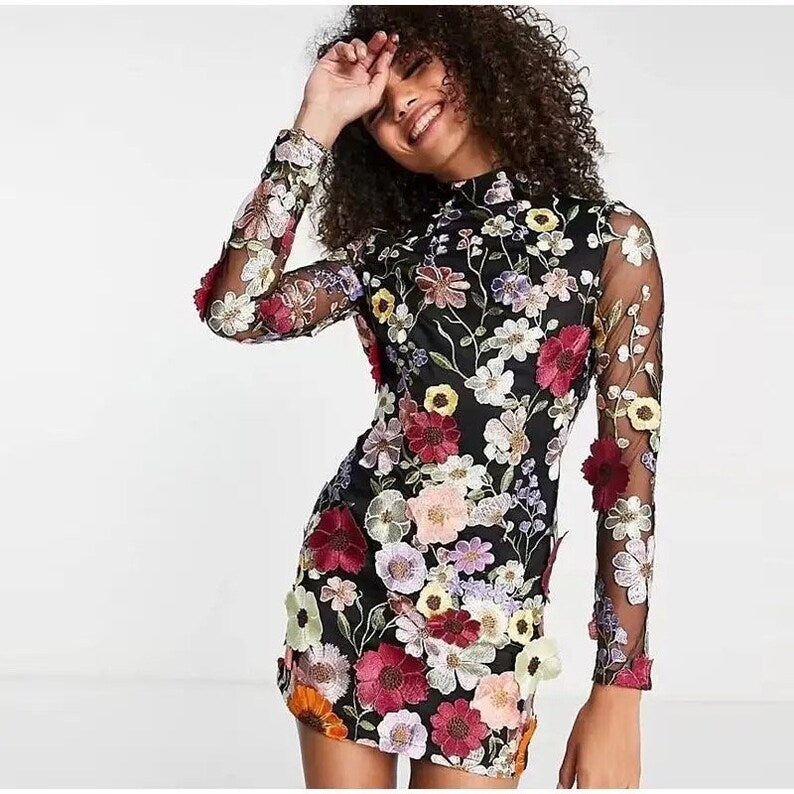Mune | Mini dress with floral appliqués and transparent appearance