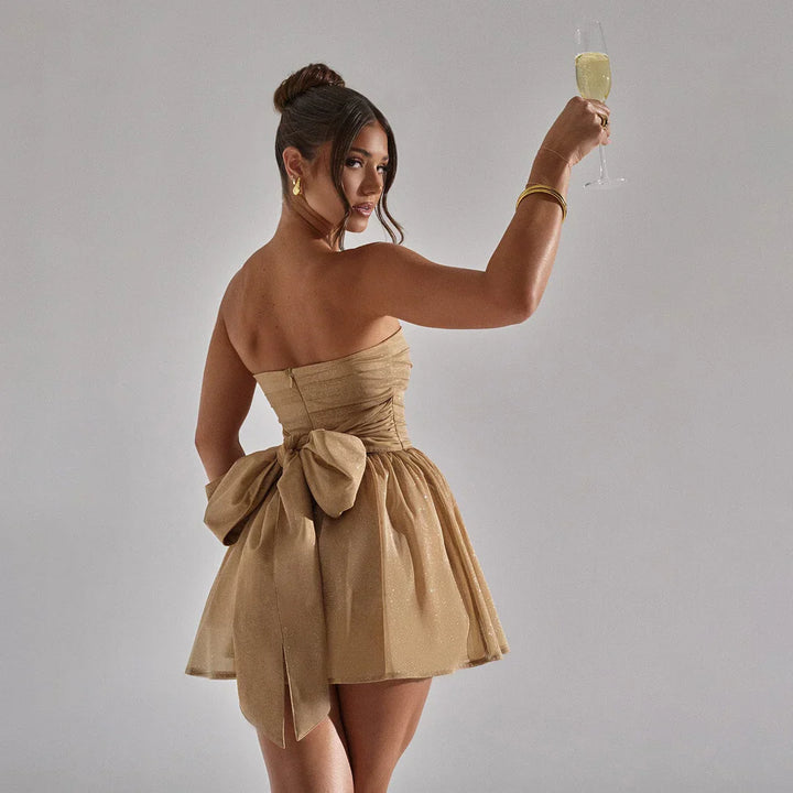 Mune | Shimmering dress with large bow